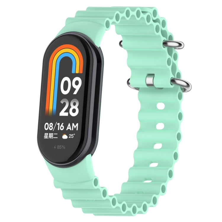 Mint green silicone watch band with perforated links and metal clasp for tracker