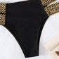 Black high-waist bikini bottom with gold chain-trim panels, flat lay