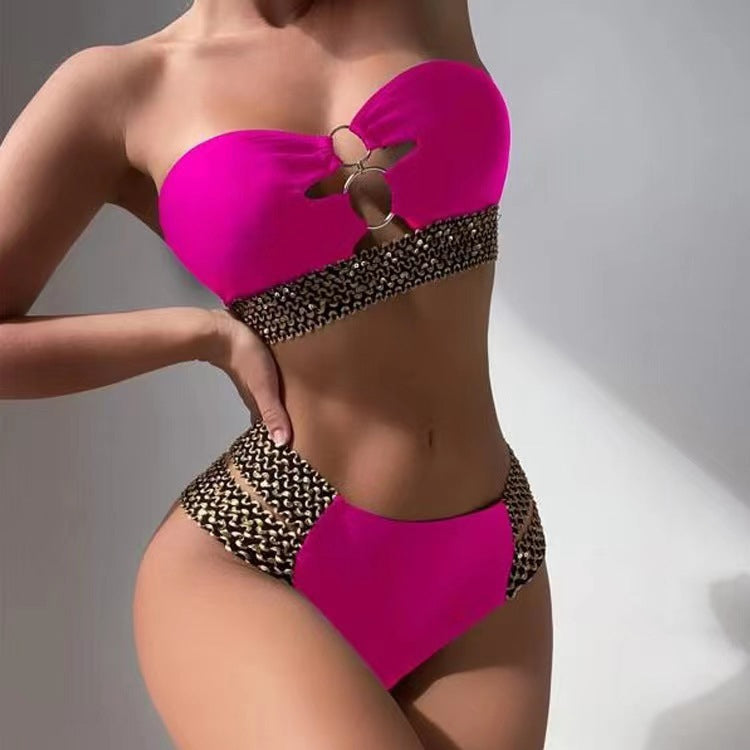 Rose-pink bandeau two-piece bikini with chain-studded high-waist bottoms
