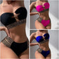 Bandeau two-piece bikini in black, blue, and rose-pink with chain-studded waist