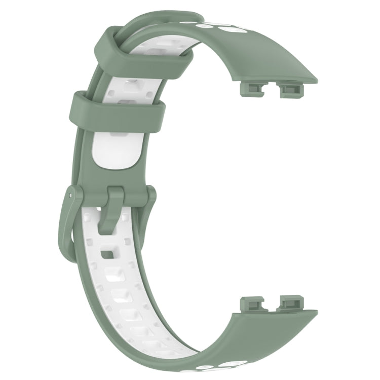 Two-tone silicone watch band in dark green with white underside and connector clips.