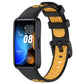 Two-tone silicone watch band with black outer and amber/yellow inner strap for Huawei.