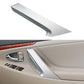 Silver interior door handle cover for Toyota Camry, installed on door panel