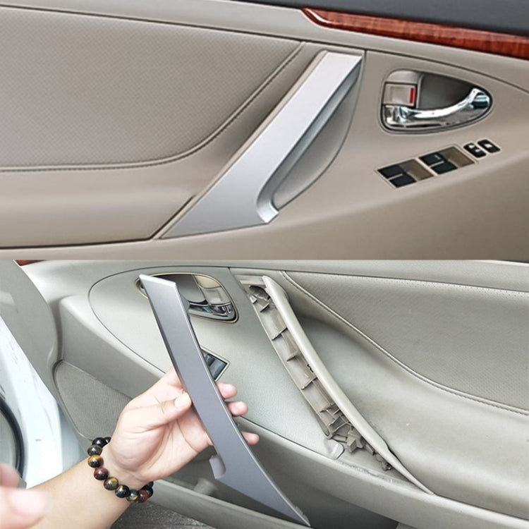 Silver interior door handle cover for Toyota Camry, close-up on car door panel