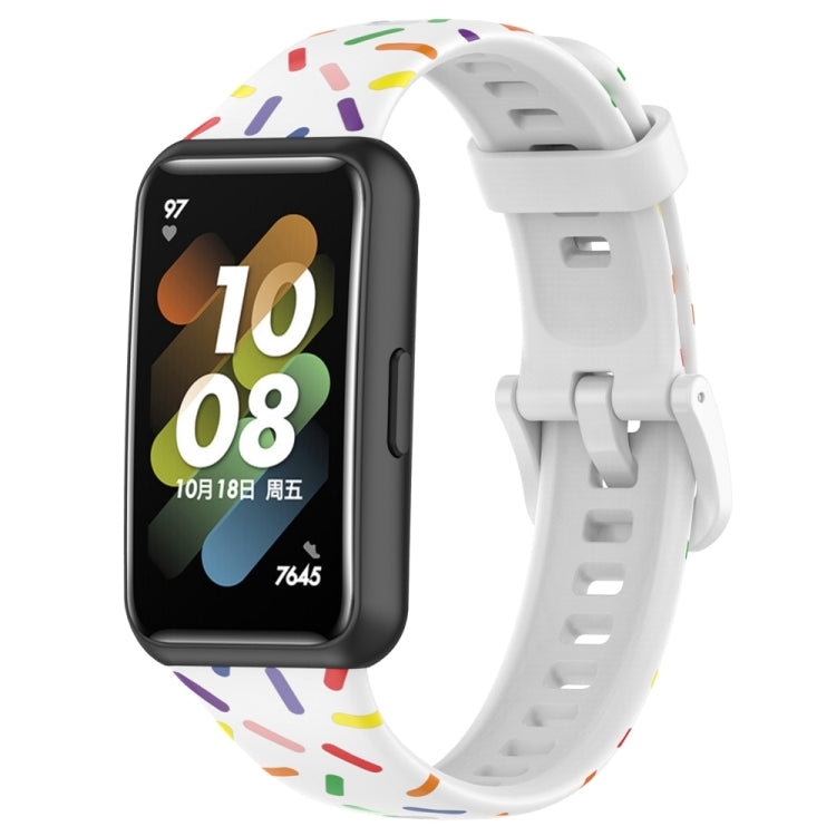 White silicone smartwatch band with rainbow dot confetti pattern and buckle-style clasp