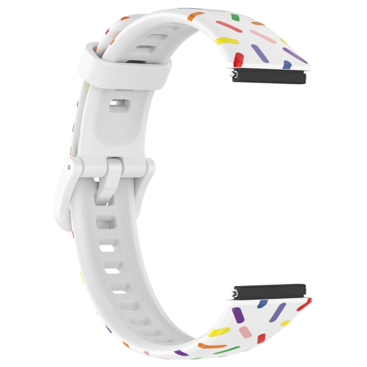 White silicone smartwatch band with rainbow dot confetti pattern and clasp hardware