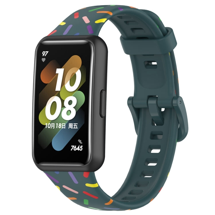 Dark green silicone smartwatch band with rainbow dot confetti pattern and buckle-style clasp