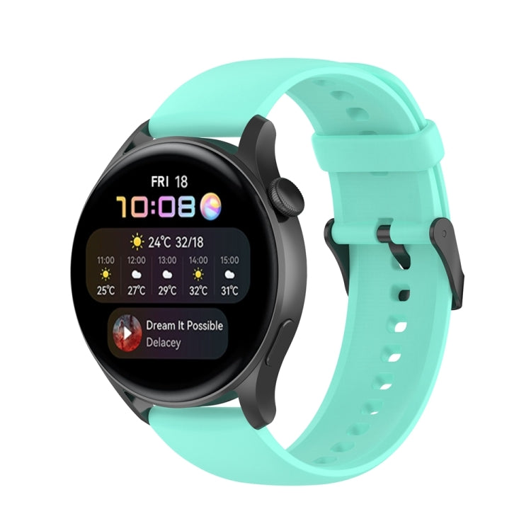 Light teal silicone watch band with stainless steel buckle and perforated strap holes