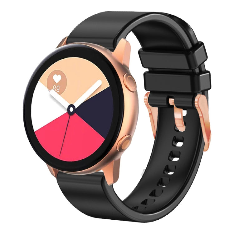Black silicone watch band with rose gold buckle and textured strap holes