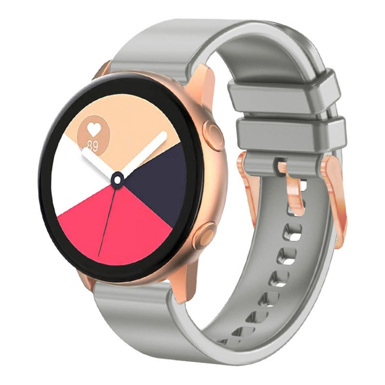 Grey silicone watch band with rose gold buckle and adjustable pin holes