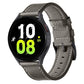 Black leather watch band with buckle and visible watch connection, stitched edge trim