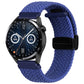 Blue woven watch band with magnetic fold clasp and black connector tab