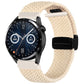 Cream woven watch band with black magnetic fold clasp, strap end looped