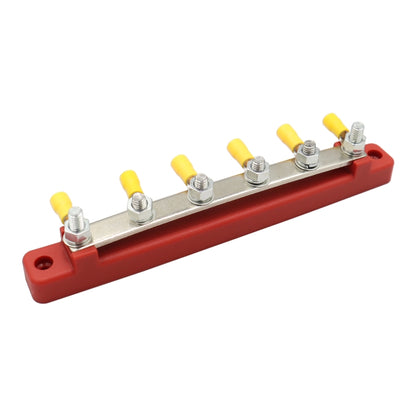 Red high-current 4-way busbar with silver rail and six yellow-ring terminals