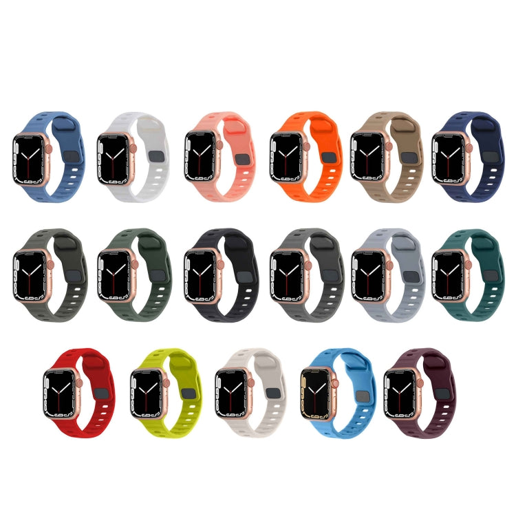 Assorted silicone watch bands in blue, white, coral, tan, and dark blue
