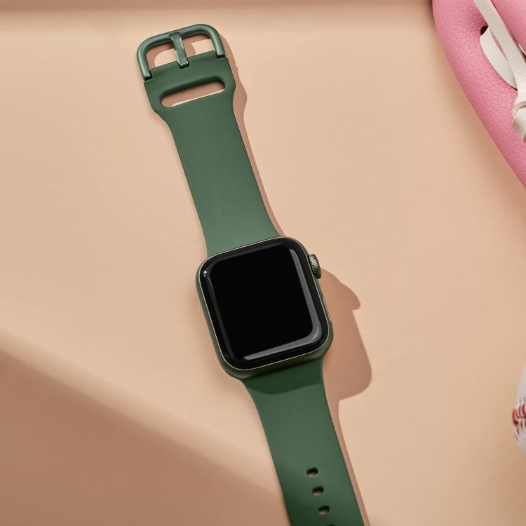 Olive green silicone watch band with pin buckle attached to a smartwatch