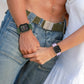 Olive green silicone watch band with pin buckle, perforated strap and clasp.