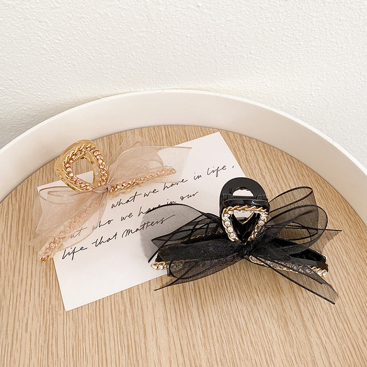 Gold-tone and black bowknot hair grippers with rhinestones and mesh lace bows