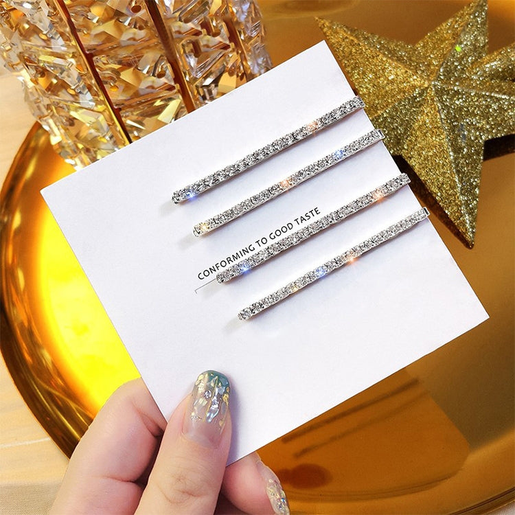 Set of 4 silver glitter rhinestone hair clips on display card