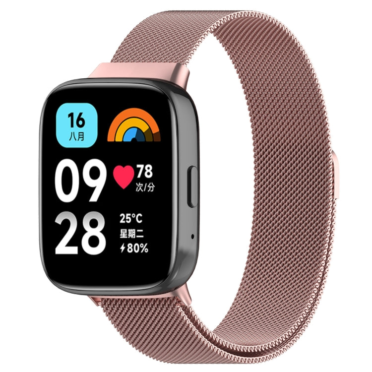 Rose pink metal mesh watch band with clasp, paired with a smartwatch