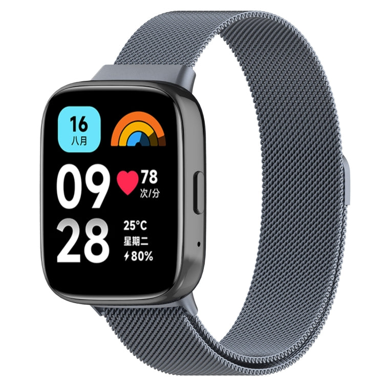 Space grey metal mesh watch band with clasp, paired with a smartwatch