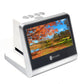 White desktop film scanner showing a landscape preview on the HD screen