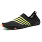 Black slip-on beach swim shoes with lime stripe bands and patterned toe guard