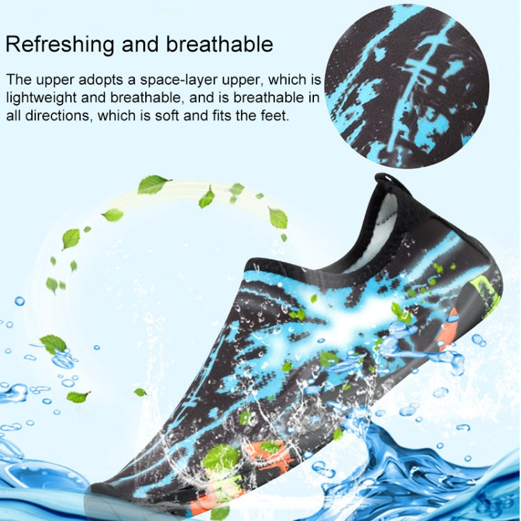 Black swim shoe with blue splash pattern upper and elastic collar