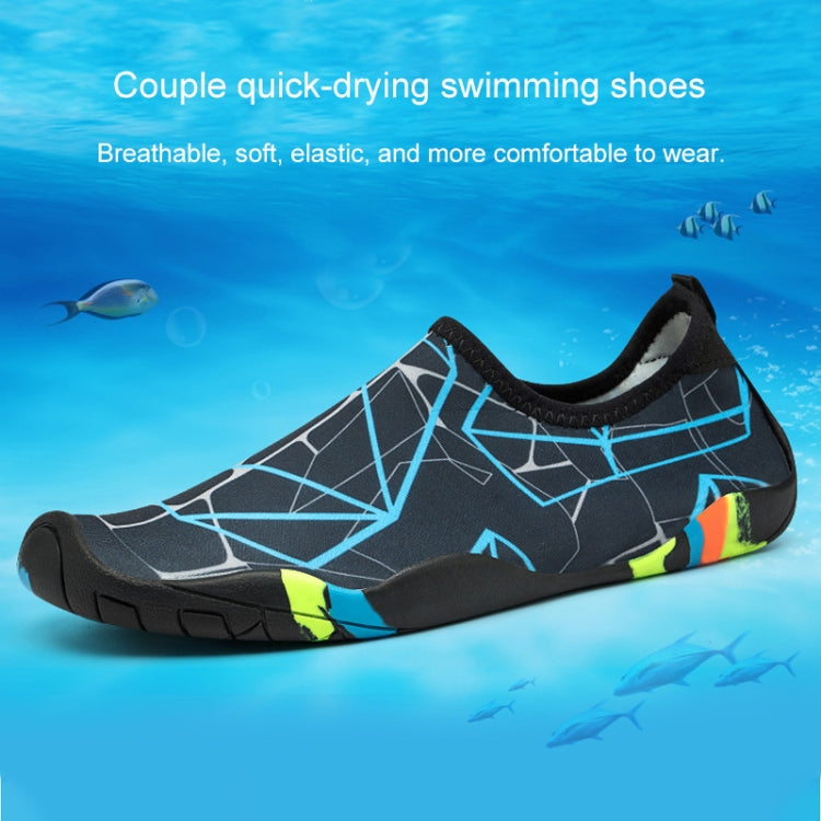Black swim shoe with geometric blue lines, neon yellow accents, and grippy thick sole