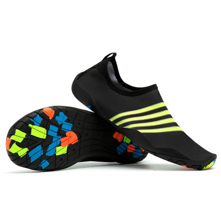 Black slip-on beach swim shoes with lime yellow stripe accents and grippy rubber sole
