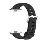 Black silicone watch band with perforated strap and detached buckle pieces
