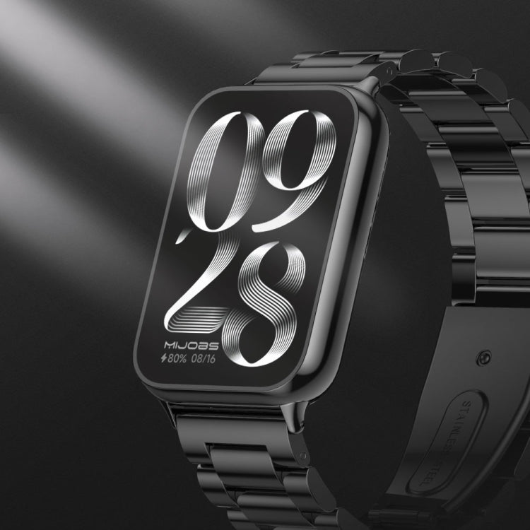 Black three-bead stainless steel watch band close-up with textured metal links