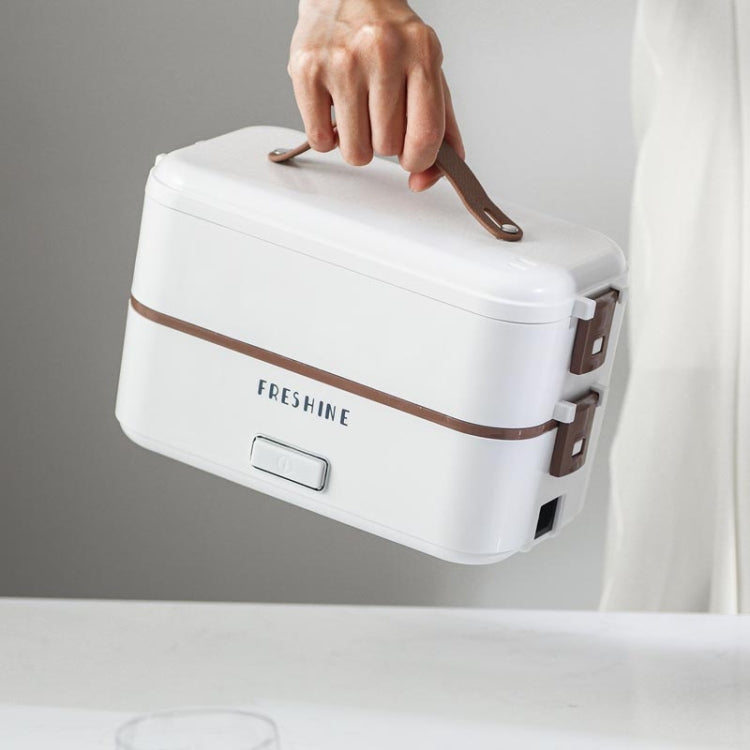 White electric lunch box with brown handle and front button on the lid