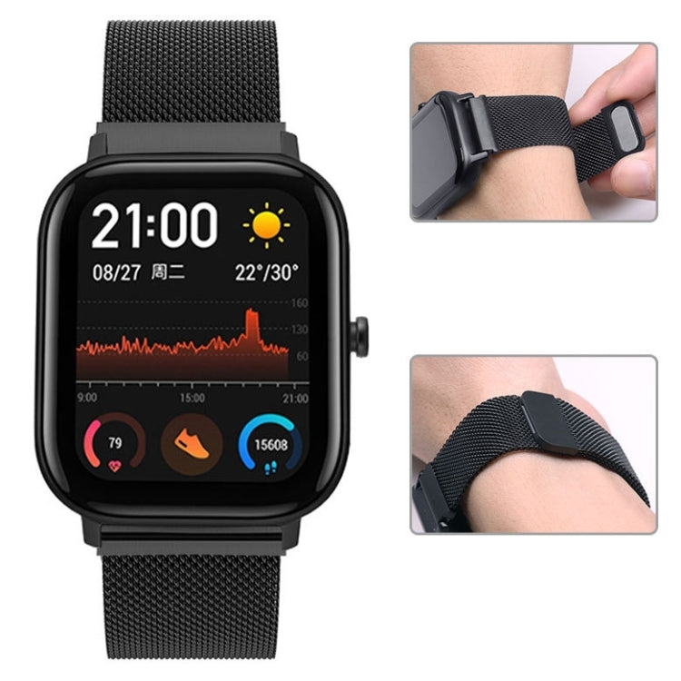Black Milanese magnetic watch strap on smartwatch, clasp and fit detail close-ups
