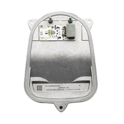 Right LED headlight control module with circuit board, silver metal housing.
