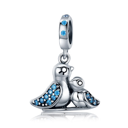 Sterling silver bird charm with blue gemstones