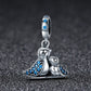 Silver bird charm bracelet accessory with blue gemstones