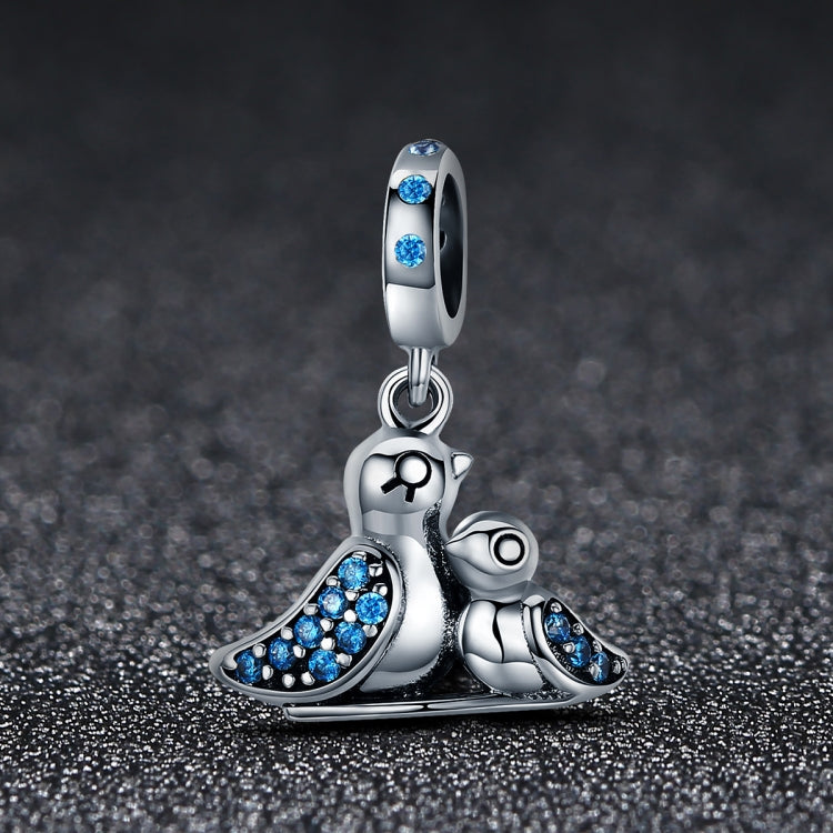 Silver bird charm bracelet accessory with blue gemstones