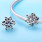 Sterling silver snowflake charm bead on snake-chain bracelet, with clasp detail