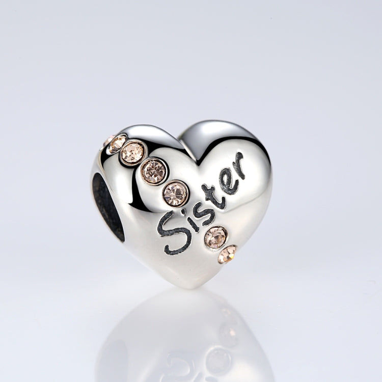 Silver heart bead with 'Sister' lettering and four clear round crystal accents