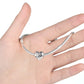 Silver link bracelet on hand with heart charm bead featuring 'Sister' and crystals
