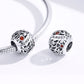 Sterling silver charm beads with January script and orange crystals on a snake bracelet