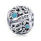 Sterling silver birthstone charm bead, December engraving with teal round gemstones