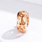 Rose gold hollow filigree charm bead with floral cutouts