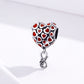 Heart charm bead in oxidized silver with repeating red heart enamel pattern