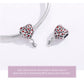 Two silver bracelet charms with red heart enamel pattern and hanging connector