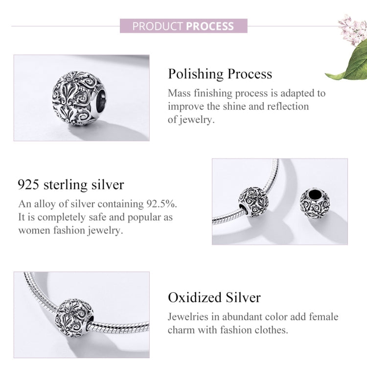 Sterling silver flower-texture charm bead on a chain bracelet link with dark opening