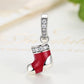 Red enamel stocking charm bead with clear crystal details and silver loop bail