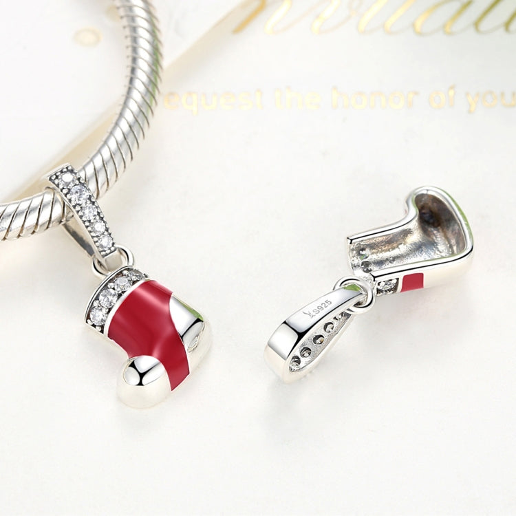 Red enamel stocking charm bead with crystal band, shown with another small silver charm