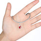 Charm bracelet with a small red enamel stocking bead hanging from the chain